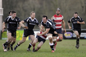 Cornish All Blacks, back-row Herbie Stupple is tackled by Dorking, fly-half Cameron Pimlow. - Photo mandatory by-line: Simon Bryant - 24/01/15, Launceston, Dorking, SSE National 2 South, Rugby Union, Sport, Cornish All Blacks, Polson Bridge, Cornwall, England,